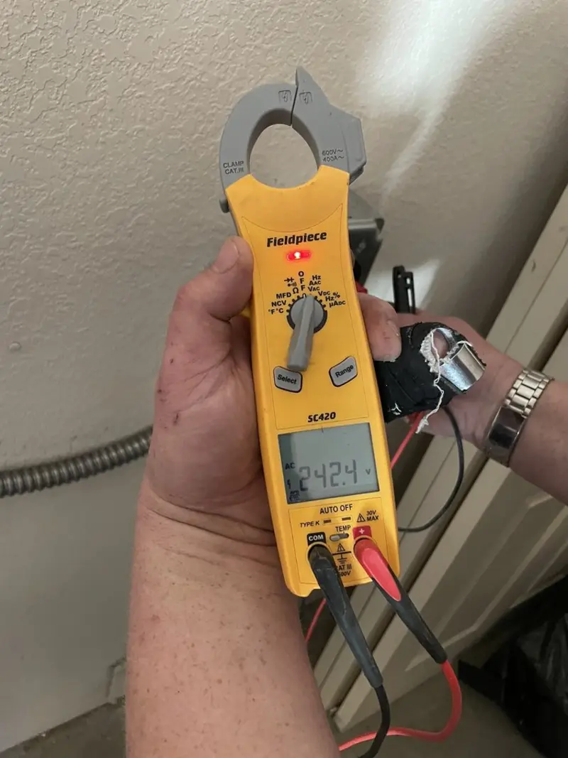 Voltage testing with clamp meter during Recessed Lighting Installation in Washington